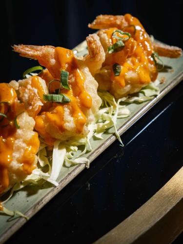 a plate of food with shrimp on top of noodles at Van der Valk Hotel Gent in Ghent