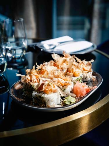 a plate of food sitting on a table at Van der Valk Hotel Gent in Ghent