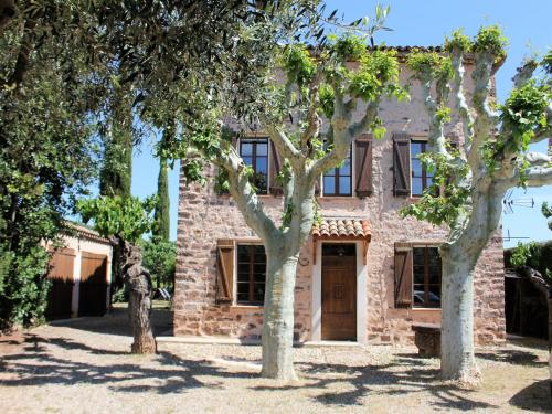 an old stone house with trees in front of it at Private Pool in Provence in La Motte