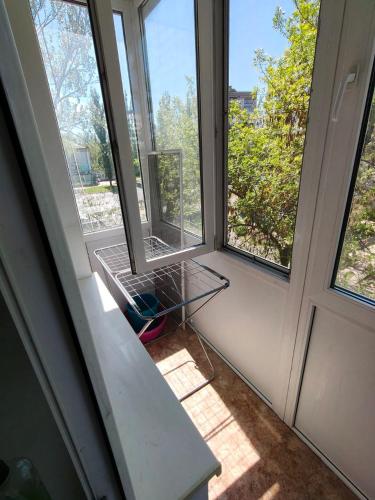 an empty room with a door and a window at Затишна 2-кімнатна квартира для спокійного сімейного відпочинку in Mykolaiv