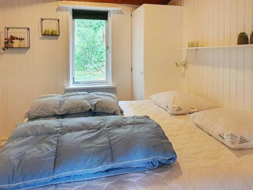 Ένα ή περισσότερα κρεβάτια σε δωμάτιο στο 10 person holiday home in Hadsund