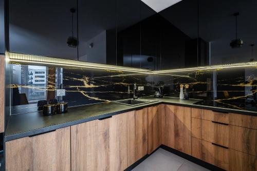 Foto Premium Apartment near Manufaktura 2 Bathrooms & Underground Parking 4