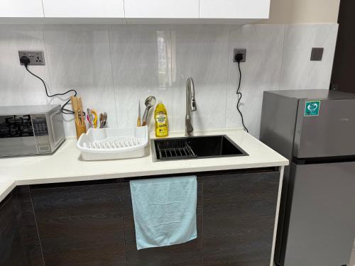 Kuchyň nebo kuchyňský kout v ubytování Kindaruma Home 1 Bedroom