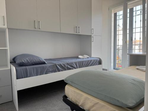 Ένα ή περισσότερα κρεβάτια σε δωμάτιο στο Riccio Di Mare Apartment