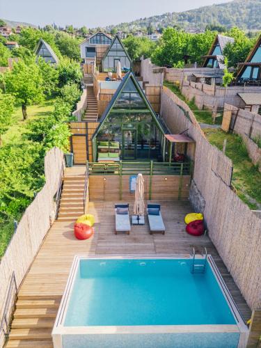 a house with a swimming pool on a wooden deck at tetova in Sapanca