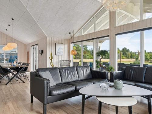 a living room with a couch and a table at Luxury Retreat in albaek - By Traum Ferienwohnungen in Ålbæk