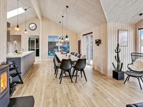 a kitchen and dining room with a table and chairs at Luxury Retreat in albaek - By Traum Ferienwohnungen in Ålbæk