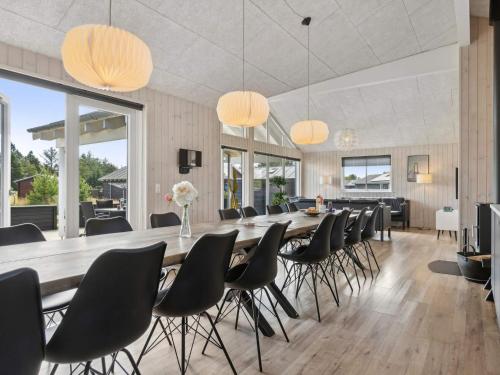 a large dining room with a long table and chairs at Luxury Retreat in albaek - By Traum Ferienwohnungen in Ålbæk