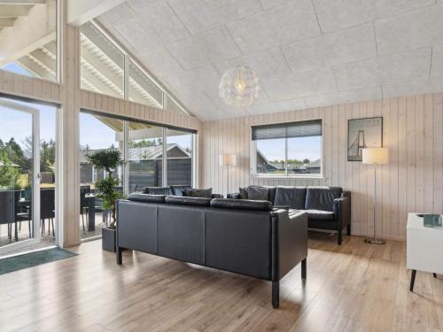 a living room with a couch and a table at Luxury Retreat in albaek - By Traum Ferienwohnungen in Ålbæk