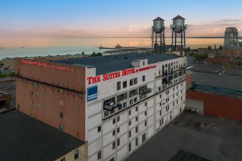 a building with a sign on the top of it at The Suites Hotel at Waterfront Plaza in Duluth