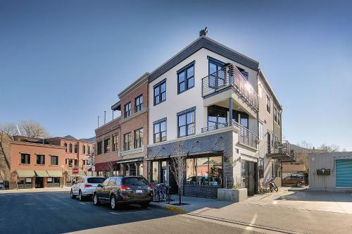 a building on a street with cars parked in front of it at She Shes Downtown Salidas Sunny Overlook in Salida