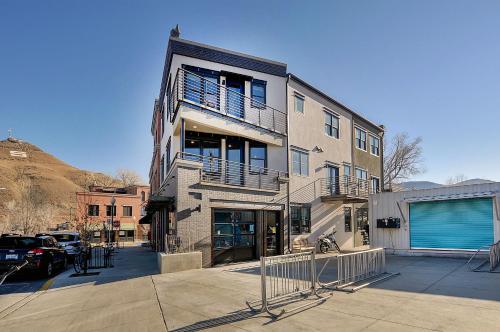 a tall building with a gate in front of it at She Shes Downtown Salidas Sunny Overlook in Salida