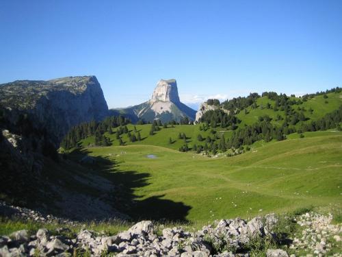 a mountain in the middle of a green field at Relaxing Retreat in Bathernay in Bathernay
