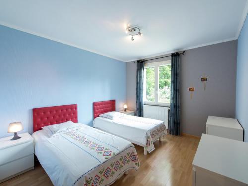 a bedroom with two beds and a window at Relaxing Retreat in Bathernay in Bathernay