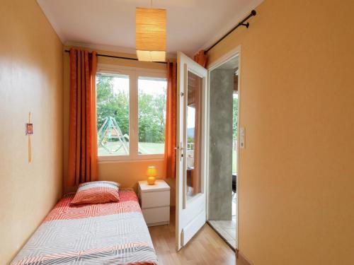 a small bedroom with a bed and a window at Relaxing Retreat in Bathernay in Bathernay