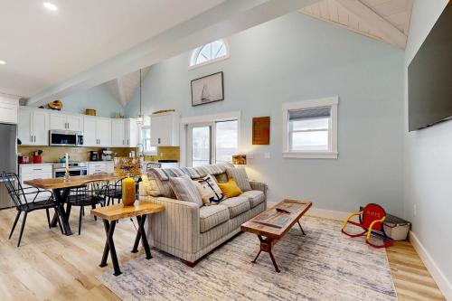 a living room with a couch and a table at The Glenora Guesthouse in Dundee