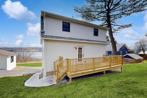 a white house with a wooden ramp in front of it at The Glenora Guesthouse in Dundee