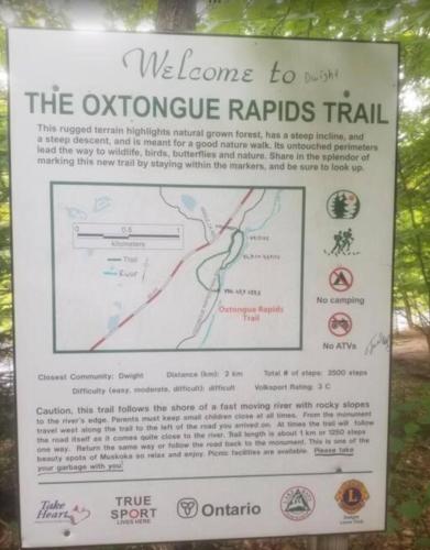 a sign at the entrance to the olympic rapids trail at Algonquin Waterfront and Winter Paradise With Sunsets in Algonquin Highlands
