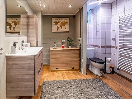 a bathroom with a toilet and a sink at Holiday home with hot tub in Vielsalm in Vielsalm