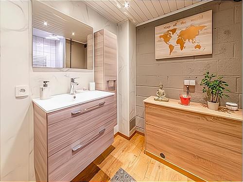 a bathroom with a sink and a mirror at Holiday home with hot tub in Vielsalm in Vielsalm