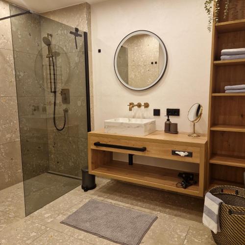 a bathroom with a sink and a shower at Apartment Lamtana in Ischgl