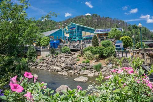 a resort with a river and flowers at A Getaway With A View by American Patriot Getaways in Shady Grove
