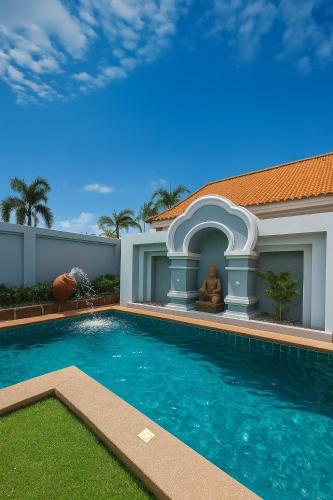 a house with a swimming pool next to a house at View Talay 2-BR Luxury Villa Private Pool-5 Min To Beach in Jomtien Beach