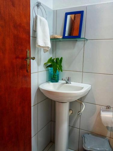 a bathroom with a sink and a plant in it at MarJeri in Jericoacoara