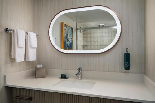 a bathroom with a sink and a mirror at DoubleTree by Hilton Brunswick in Parkwood