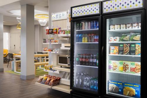 a refrigerator full of food and drinks in a store at Spark By Hilton Guelph in Guelph