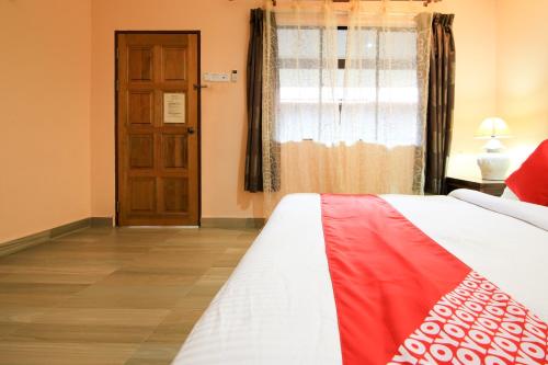 Ein Bett oder Betten in einem Zimmer der Unterkunft Hotel O Ombak Inn Chalet