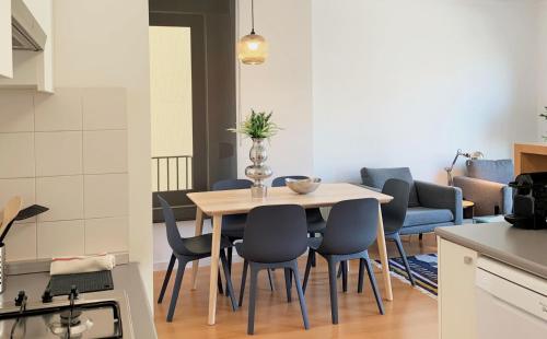 a kitchen and dining room with a table and chairs at MM1 Cosy & Central Apartment in Baixa with Castle View and Free Parking! in Lisbon