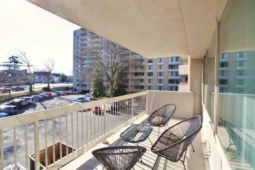 a balcony with chairs and a view of a parking lot at Great Apt w All You're Needing in Arlington