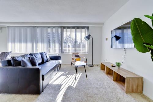 a living room with a couch and a table at Great Apt w All You're Needing in Arlington