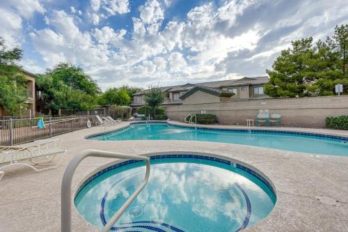 a large swimming pool in a courtyard at 1 Mi to Golf Lake-View Condo with Pool in Chandler! in Chandler