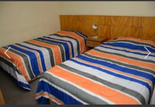 Postel nebo postele na pokoji v ubytování HOTEL ROYAL