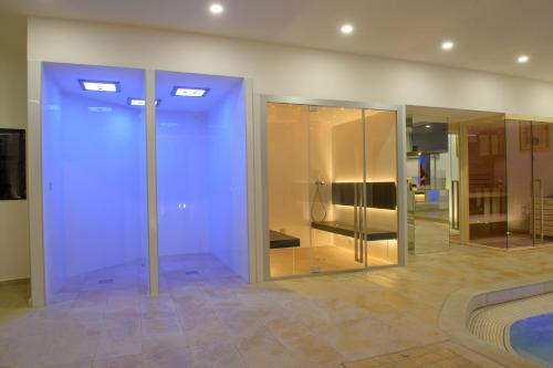 a room with some glass doors in a building at La Magia Lucana in Colobraro