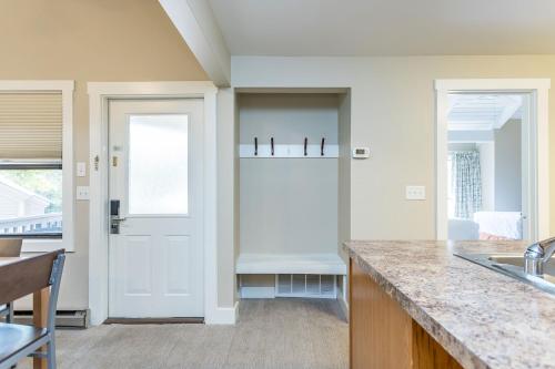 a kitchen with a white door and a counter at Massanuttens Shenandoah Villas by TripForth in McGaheysville