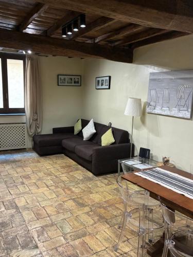 a living room with a couch and a table at Domus Antica Navona in Rome