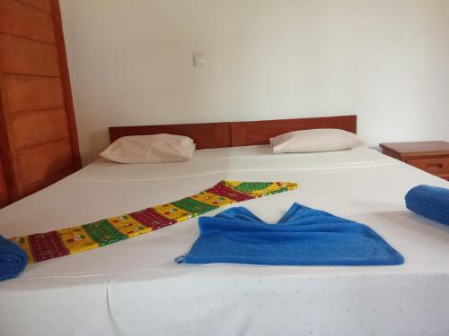 Ein Bett oder Betten in einem Zimmer der Unterkunft Domus Praia Jalé