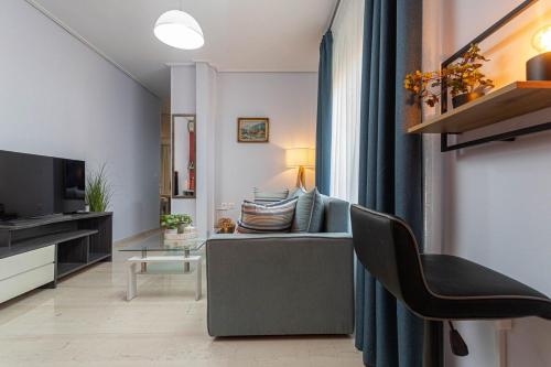 Μια τηλεόραση ή/και κέντρο ψυχαγωγίας στο Tranquil Vibes Comfortable Apartment
