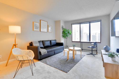 a living room with a couch and a table at Prime Location Near Pentagon and Metro in Arlington