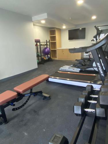 a room with a gym with a treadmill and a tv at Best Western Montrose Inn in Montrose