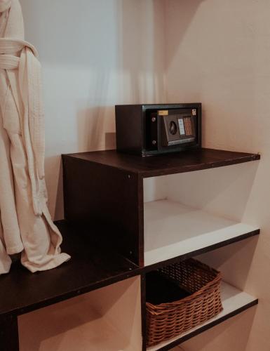 a radio sitting on top of a shelf at Niken Beachfront Tulum Hotel in Tulum