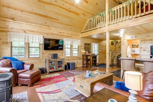 a living room with a couch and chairs in a cabin at Idyllic Cabin in the Heart of Hocking Hills in Rockbridge