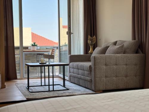 a living room with a couch and a table at Vila Palas in Vrnjačka Banja