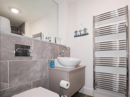 a bathroom with a sink and a toilet in it at The Nook in Inverness