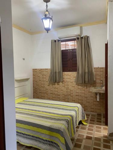 Ένα ή περισσότερα κρεβάτια σε δωμάτιο στο Duplex praia de camarupim