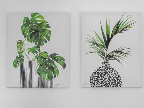 two pictures of a plant in a black and white pineapple at Mollison 2 Bedroom Apartment - Harthill in Harthill