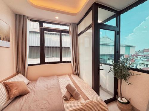 Cama o camas de una habitación en The Little Hanoi - Fresh Home - Centered